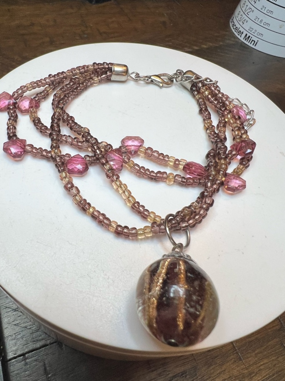 Multi-Strand Pink and Brown Beaded with glass pendant bracelet